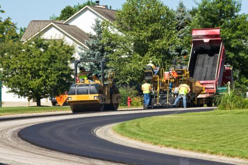 Laying new pavement in a residential neighborhood